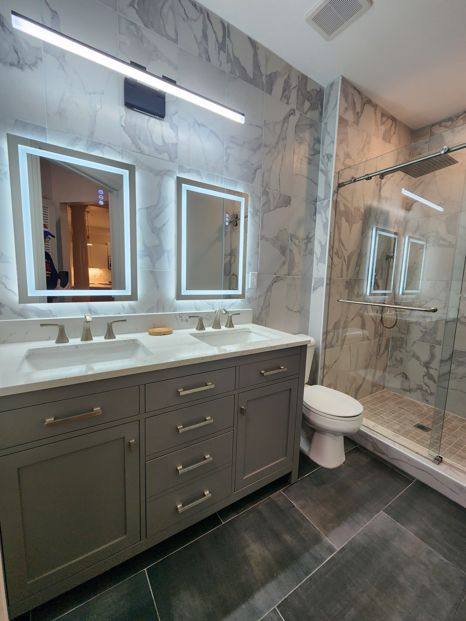 Renovated bathroom. Double vanity. Backlit mirrors. 2person walk in shower with seat. - 5559 glenridge dr,