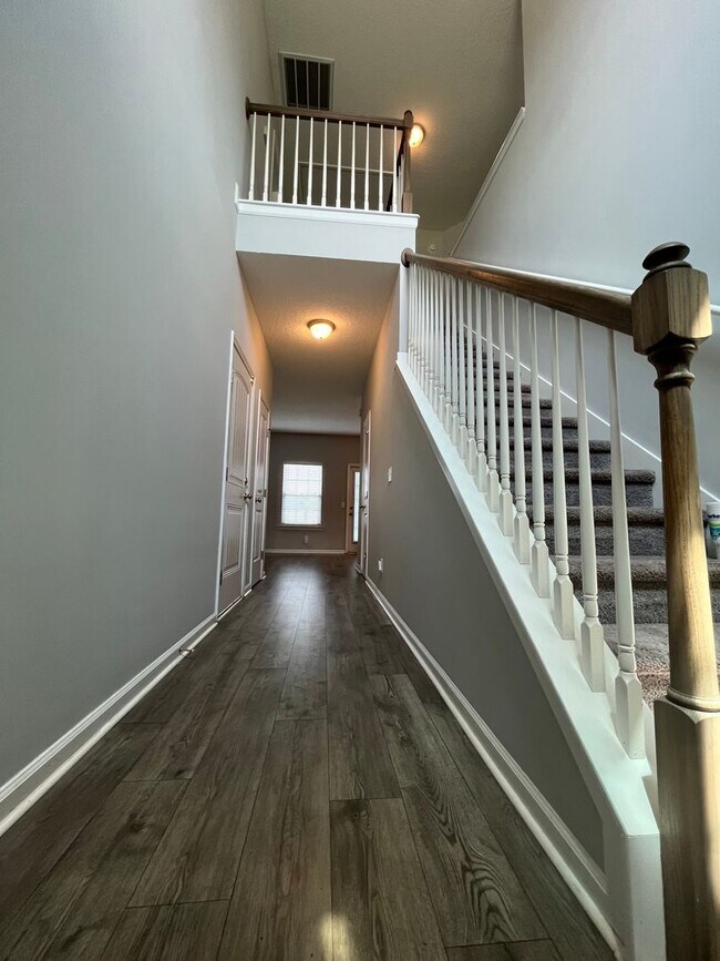 Building Photo - Spacious 4-Bedroom Pet Friendly Home with a Serene View - Available for Rent!
