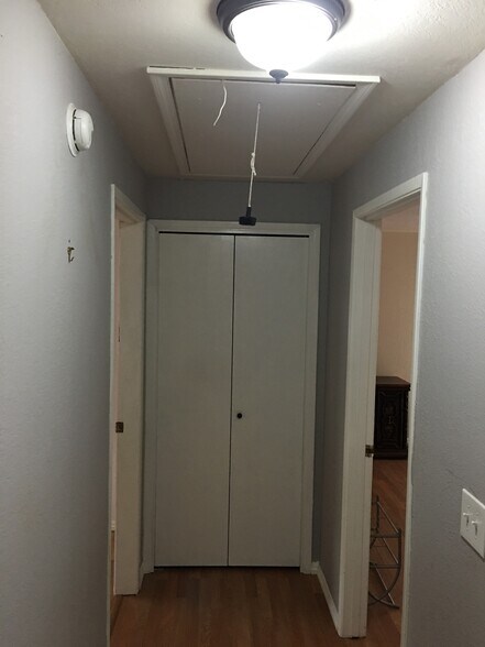 Hall linen closet with cleaning supplies - 2710 Oliver Ave
