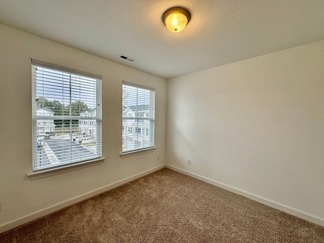 Building Photo - Practically New & Available NOW! Americana Luxury Townhomes! Pet Friendly! Attached Garage! All A...