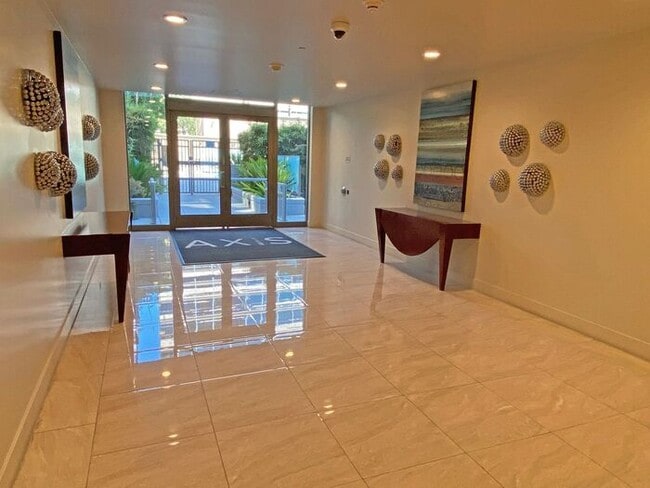Building Photo - Live at The Axis High-Rise! Upscale, Urban...