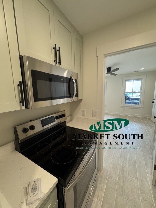 Building Photo - **APPLICATION PENDING! GORGEOUS NEW CONSTR...