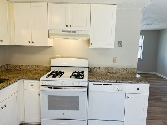 Building Photo - Wow! Check out this charming 4-bedroom, 1-...