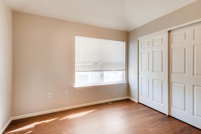 Building Photo - Stunning 3-bed 3-bath townhome that features hardwood floors and an attached 2-car garage!