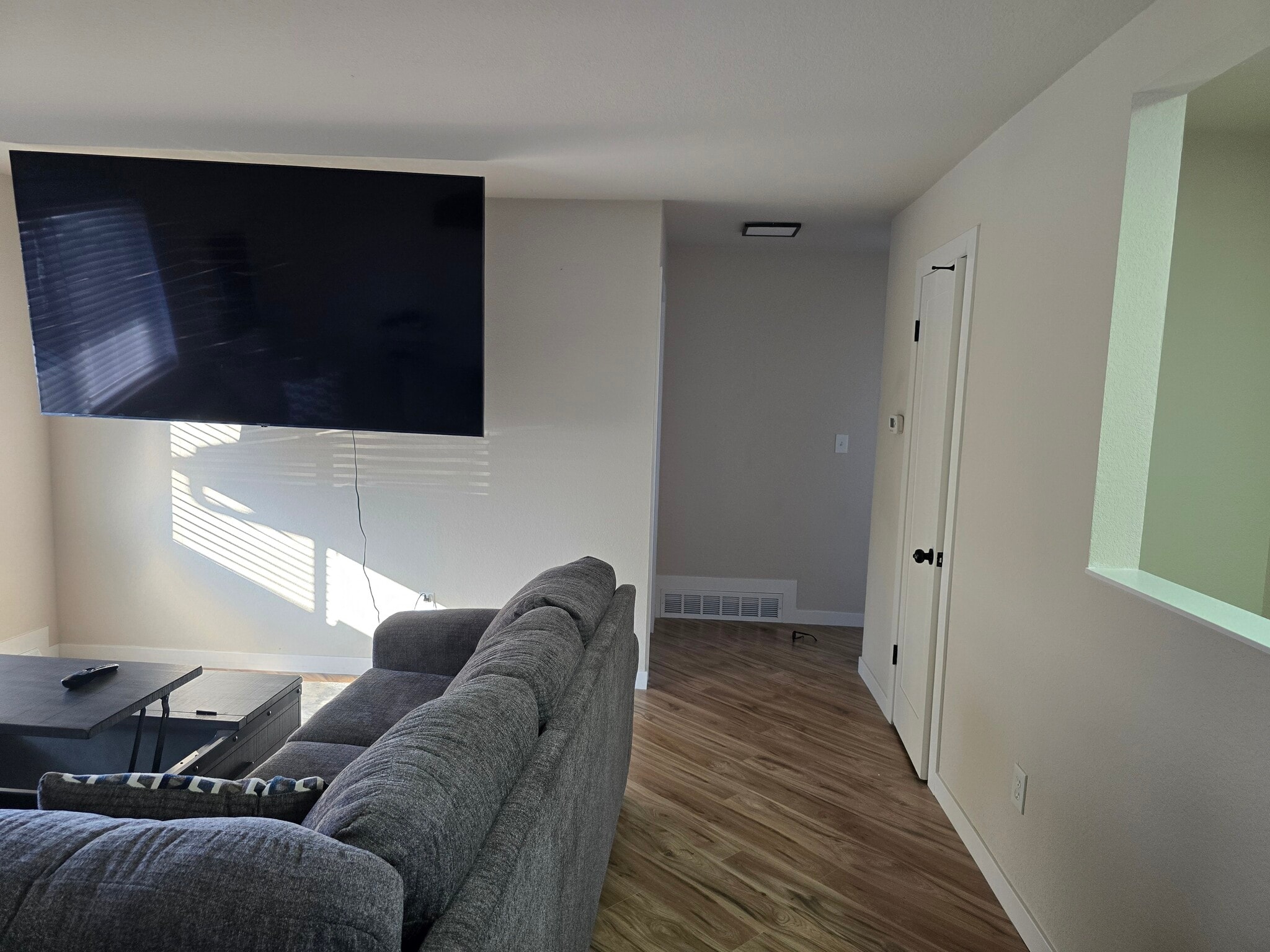 Living room looking down hallway into bedrooms. - 902 S Zephyr Ct