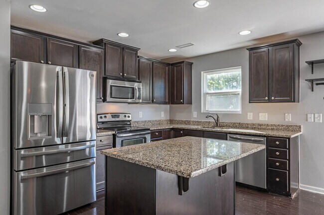 Building Photo - Available on July 10! Experience modern comfort in this spacious 4+ bedroom home