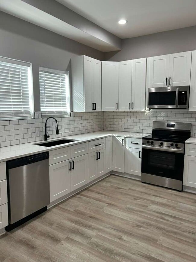 Building Photo - MOVE IN SPECIAL - Modern, Chic and brand new 2 bedroom with an office -   Discover This Home That...