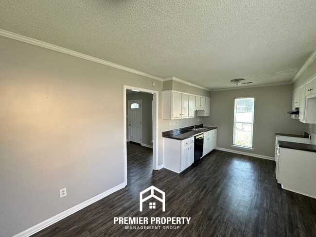 Building Photo - Charming 3BR/2BA Near Southwind | High Vaulted Ceilings, Hardwood Floors & Fireplace