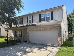 Building Photo - Fully Furnished 4-Bedroom Home with a Stocked Kitchen, Fenced Yard, and 2-Car Garage