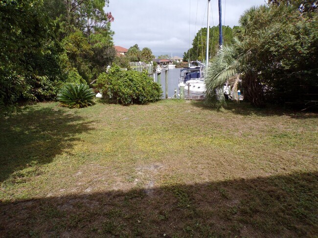 Building Photo - Live the Gulf Breeze Waterfront Life – Doc...