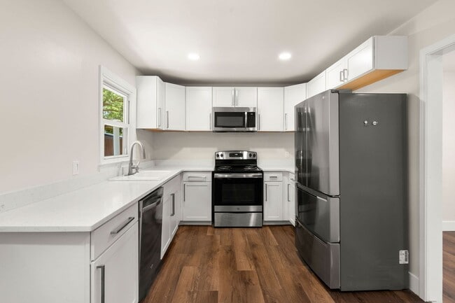 Building Photo - Spacious Split-Level Living with Dual Fireplaces & Expansive Deck