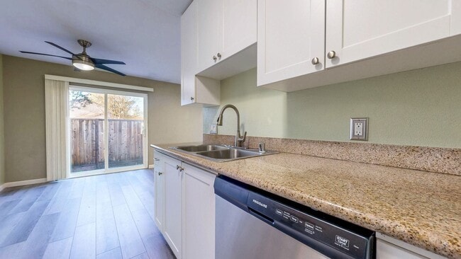 Building Photo - Cozy 1 bedroom 1 bath end unit condo with 1 car garage and private patio located next to Peterson...