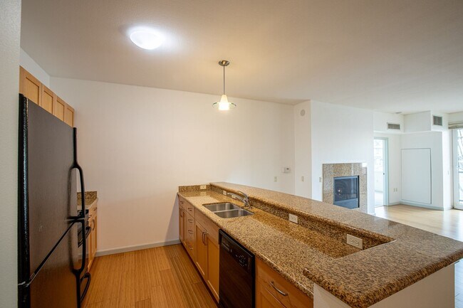 Building Photo - Sweet + secure 1/1 condo with parking, extra storage room + AC available now!