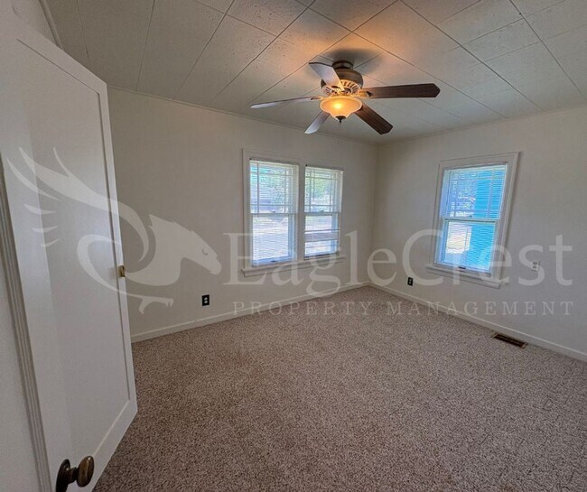 Building Photo - Three Bedroom, Two Bathroom House with Fenced Yard and Outdoor Fireplace