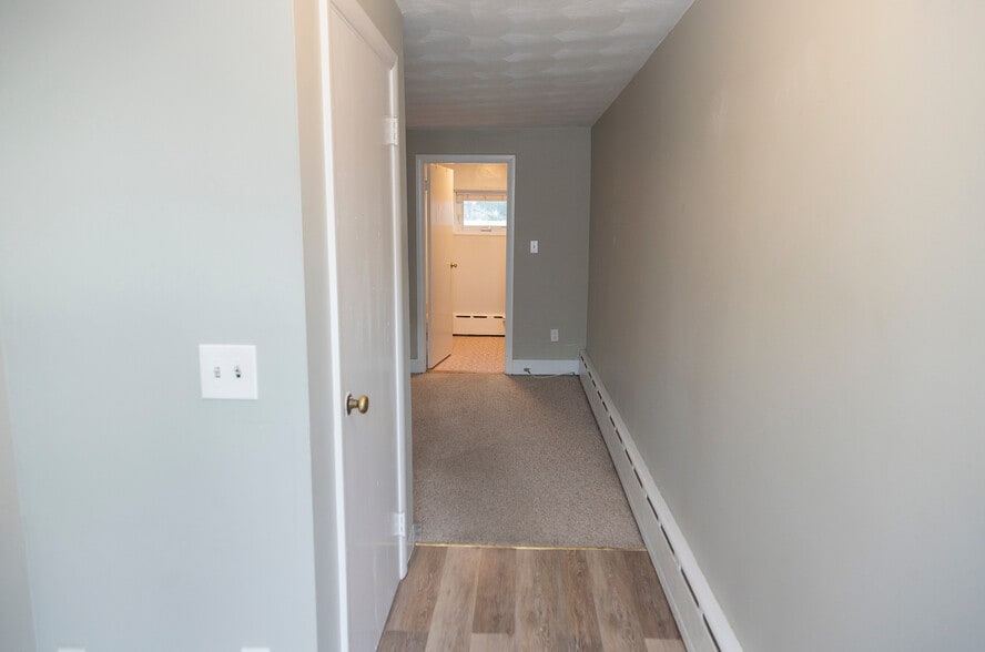 Entrance hallway with closet on left - 63C Brewster Ave