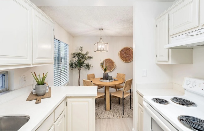 Building Photo - The updated bathroom offers a shower-over-...