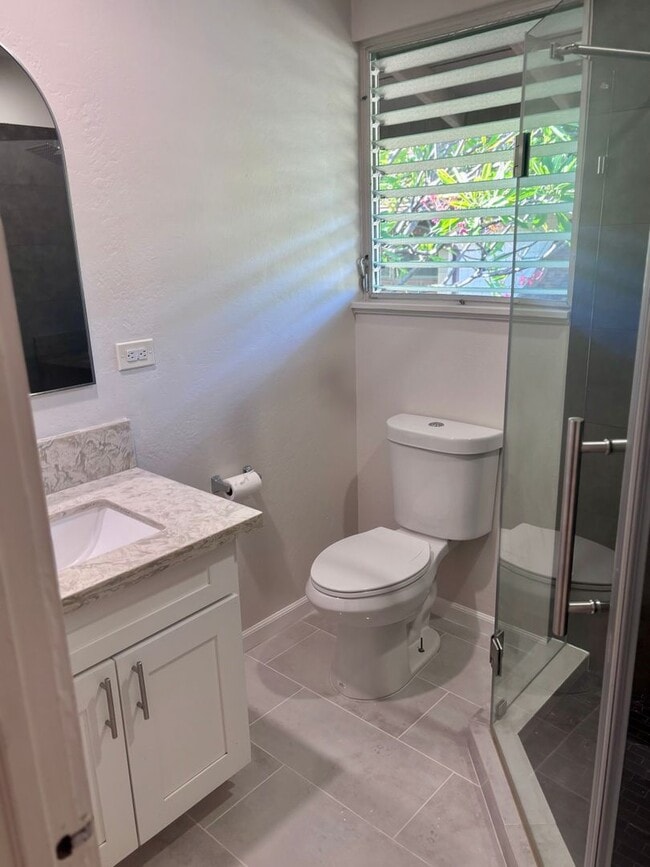 Building Photo - Available Now | 2 Bedroom, 2 Bathroom Townhouse with 1 Assigned Parking Stall at Tropic Gardens 1