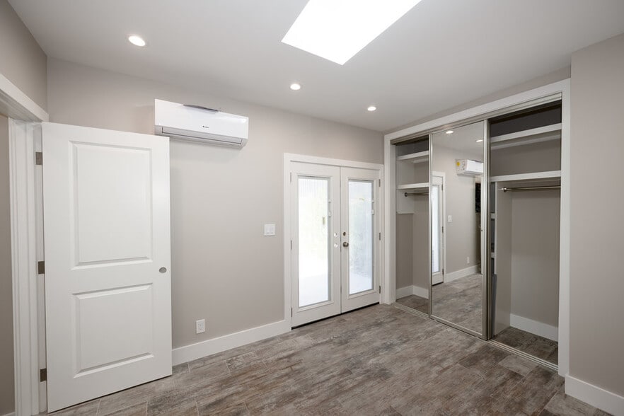 View of bedroom with doors leading to the private patio - 498 S Marengo Ave