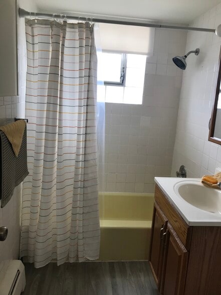 Shower /tub combo with2 lined closets in hallway. - 8616 47th St