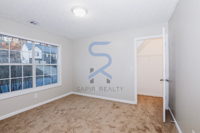 Building Photo - Move in before February 28th and choose your reward: a $250 Amazon Gift Card or a 55" Smart TV!