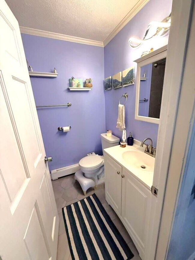 Building Photo - Spacious and updated 3-bedroom condo just 2 blocks from Airport T Station!