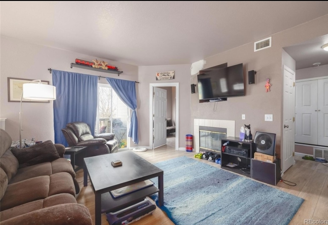 Living room with gas fireplace - 8707 E Florida Ave