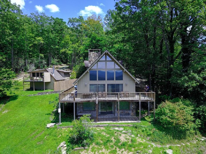 drone shot with mountains reflecting in upper glass - 1225 Becky Mountain Road