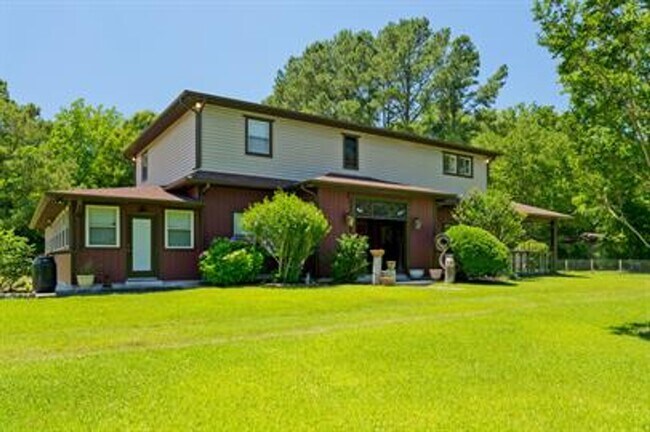 Building Photo - Uniquely breathtaking custom home with in-...