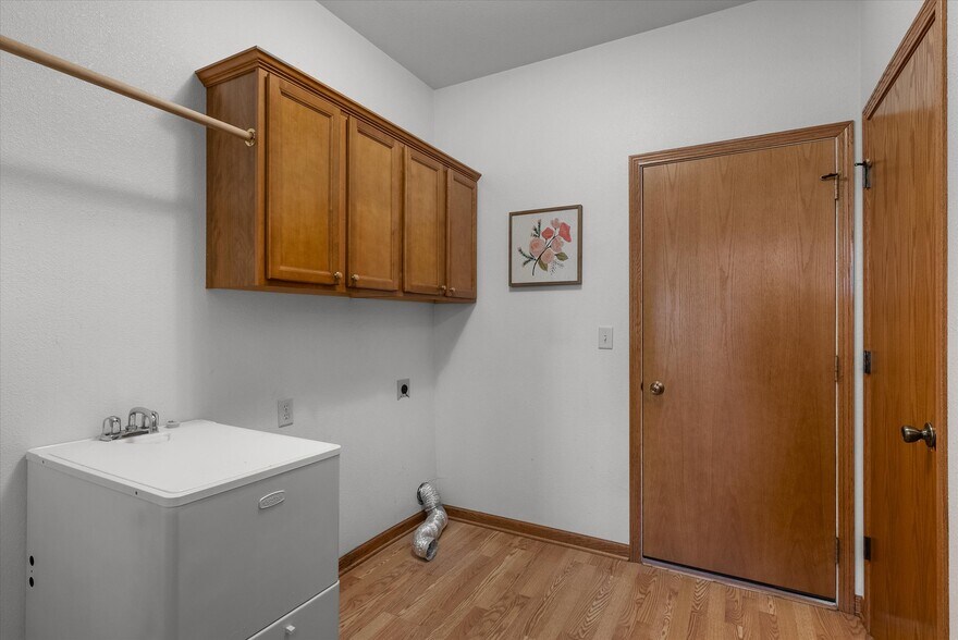 W/D hookups conveniently located off garage/kitchen - 407 Century Oak Dr