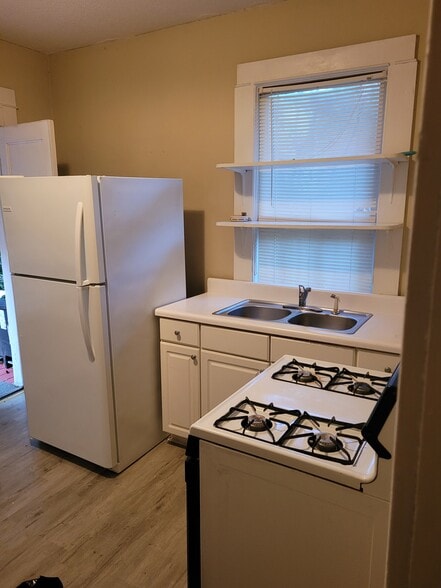 Kitchen showing stove sink and refrigerator - 2763 Vineville Ave