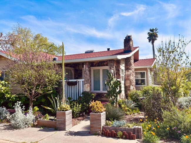 Building Photo - Welcome to this stunning 4-bedroom, 2-bath...