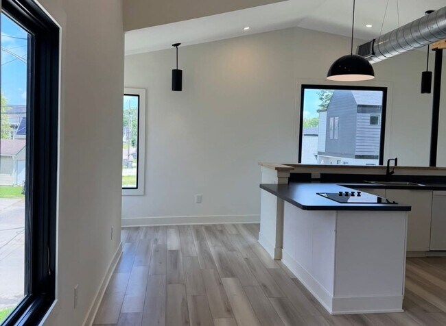 Building Photo - Vaulted Ceilings & Hardwood Floors in This Charming Indianapolis L