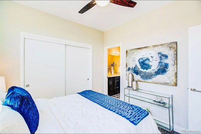 Relax in this serene bedroom with stylish decor and a convenient en-suite bathroom. - Harley House