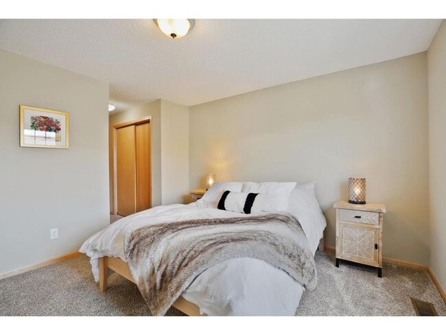 Primary bedroom. - 4800 Underwood Ln N