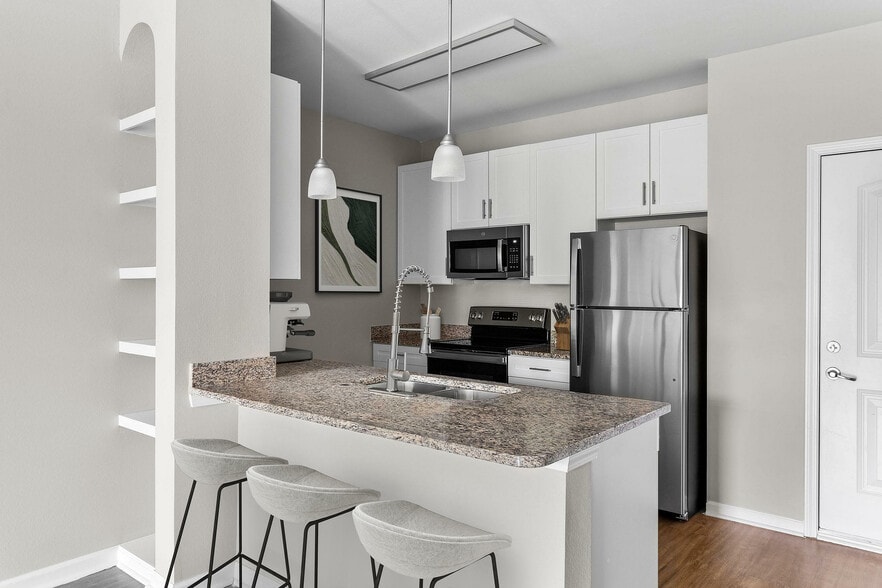 Experience the elegance of this modern kitchen, perfect for culinary creativity. - The Addison at South Tryon