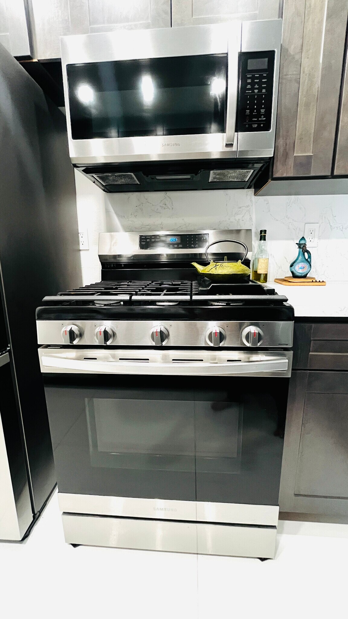 New kitchen with stainless steel refrigerator, dishwasher, stove with built-in air fryer, microwave - 6600 Warner Ave