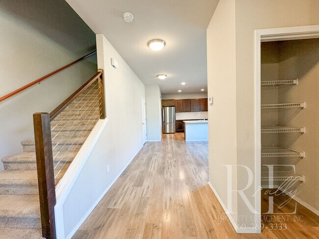 Building Photo - Modern End-Unit Townhome with Private Fenced Yard, Gourmet Kitchen & Spacious Layout