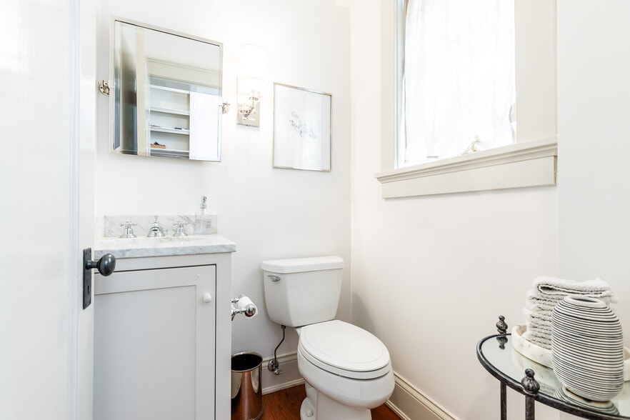 Powder room is off hallway to outdoor entertainment areas. - 4061 Beechwood Ave