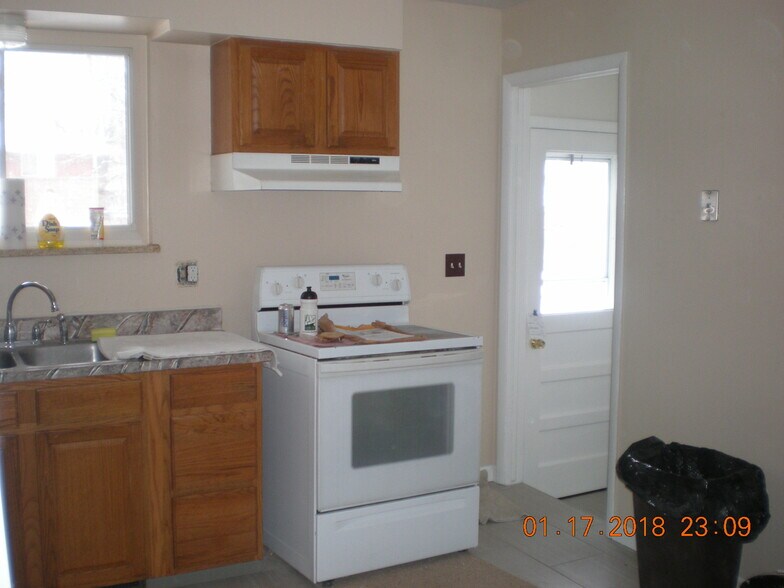 Back door from kitchen to parking, and stairs to basement. - 1160 Clinton St