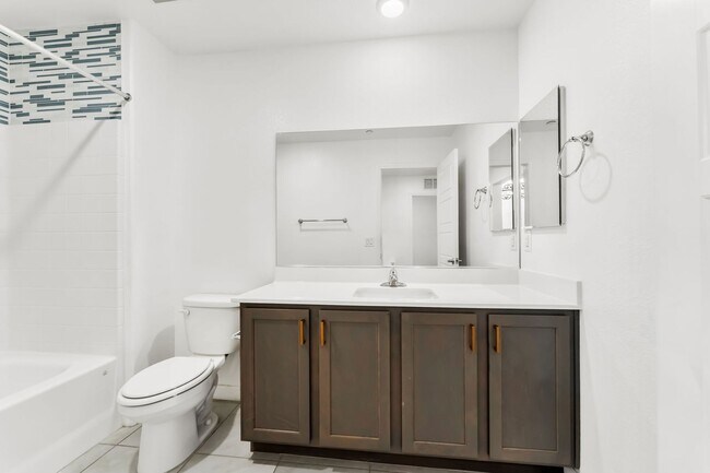 Building Photo - Modern Gated Townhome with Flexible Living Spaces & Stylish Finishes!