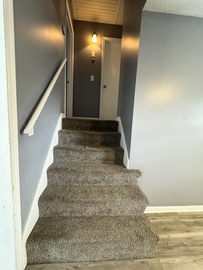 Stairs to second level bedrooms and bathroom - 518 E 97 Terrace