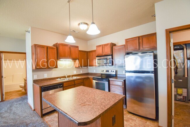 Building Photo - Spring Move-in special; 2 Bedroom 2 Bath Condo on the Ground level with detached garage!