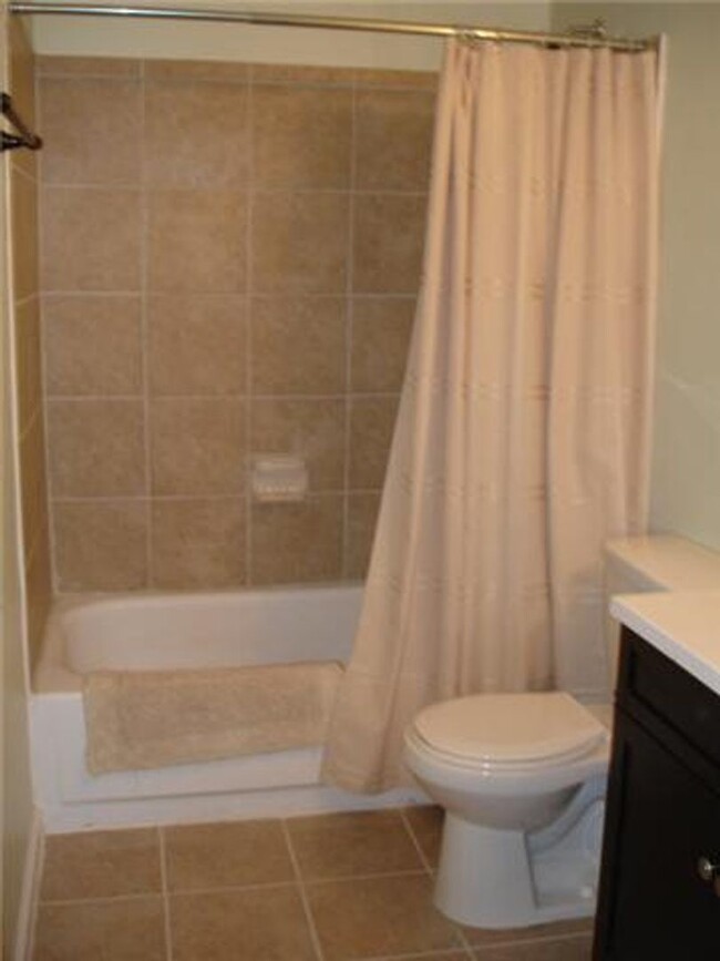 Building Photo - Location + Amenities + Covered Parking