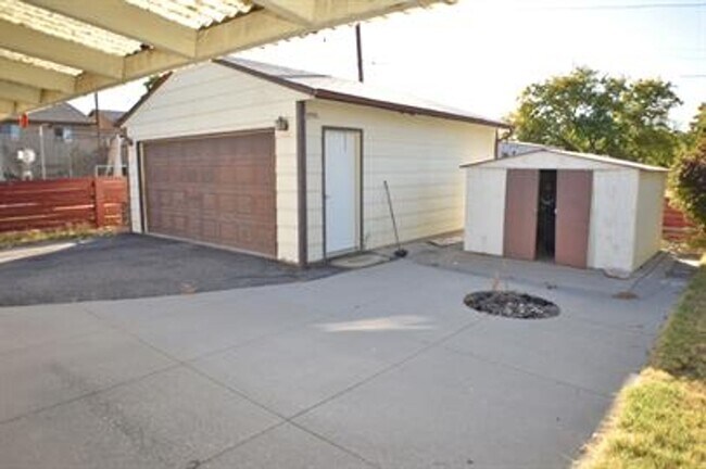 Building Photo - Updated house with original hardwoods and 2-car garage!