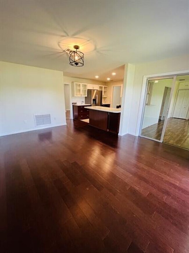 Building Photo - Eustis Lake Front Home with 2 Primary Bedr...