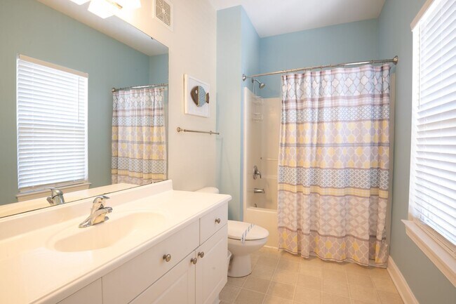 Building Photo - PRICE REDUCTION! LIVE AT THE BEACH FOR THE WINTER - AVAILABLE MID-MARCH