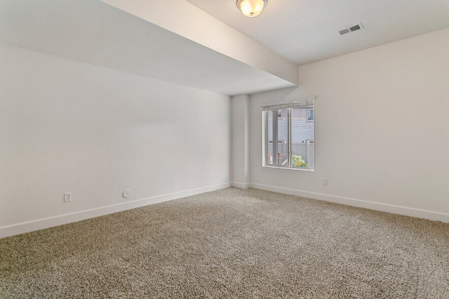 Building Photo - Spacious Banning Lewis Home with Finished ...