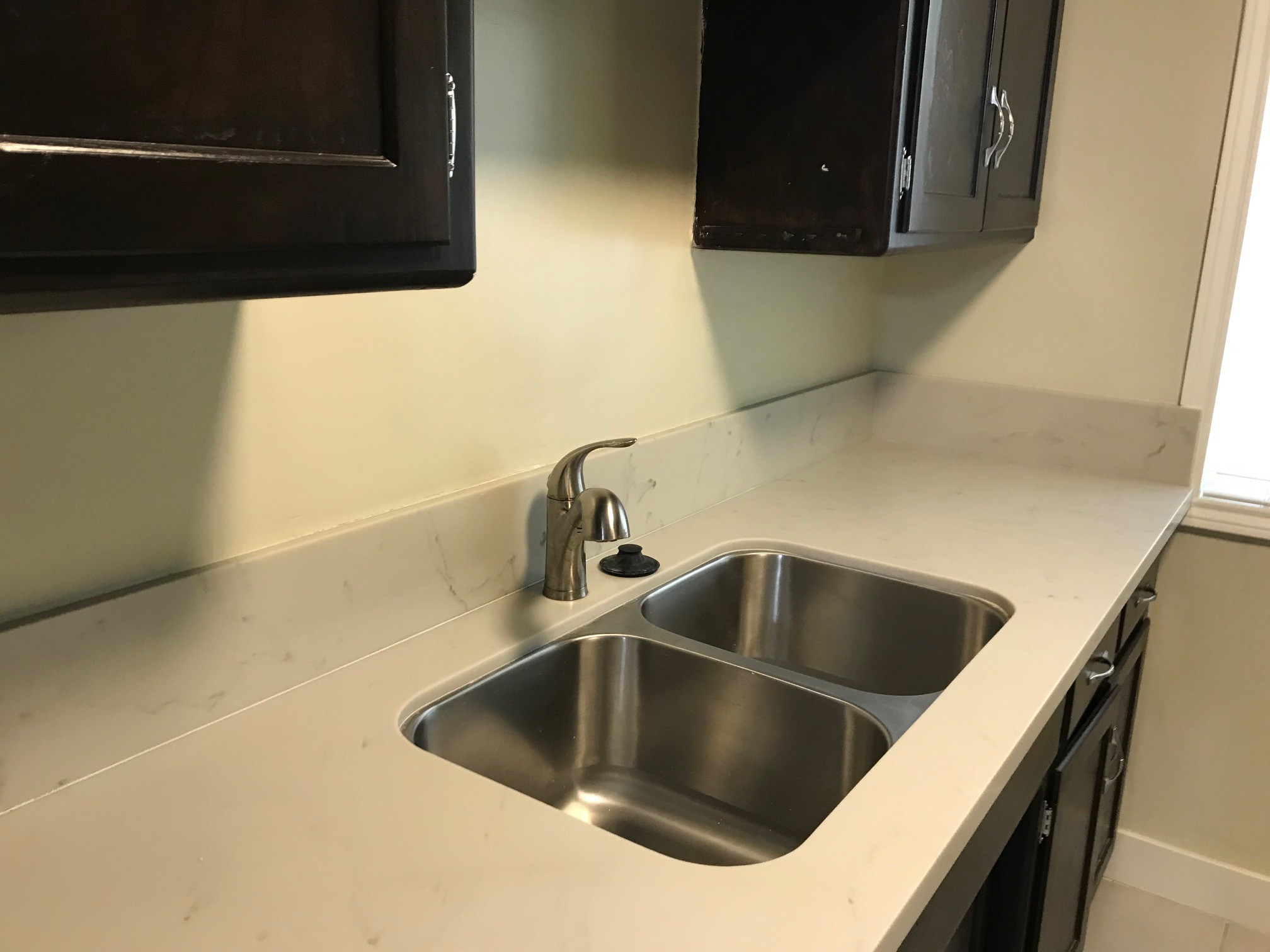 Kitchen - new counter tops and sink - 325 S Doheny Dr