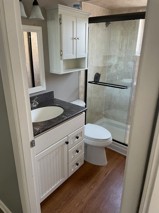 Building Photo - 55+ Charming first-floor condo nestled in ...