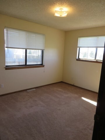 Building Photo - 3 bedroom Ranch Style Duplex backing to open space.